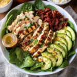 Grilled Chicken Sun Dried Tomato and Avocado Spinach Salad