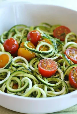 Raw Spiralized Zucchini Noodles with Tomatoes and Pesto