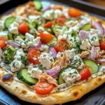pizza topped with tzatziki sauce
